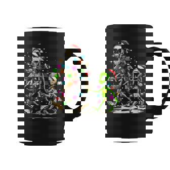 Alien And Bigfoot Wearing A Santa Hat And Christmas Lights Coffee Mug | Mazezy