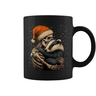 Skeleton Hugging Badger Santa Hat Snow Gothic Christmas Coffee Mug - Monsterry