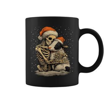Skeleton Hugging Cow Santa Hat Snow Gothic Christmas Animal Coffee Mug - Monsterry