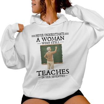 Never Underestimate Woman Who Still Teaches In Her Seventies Women Hoodie - Seseable
