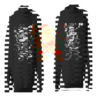 Christmas Lights Santa Claus Playing Baseball Christmas Sweatshirt Unisex | Mazezy