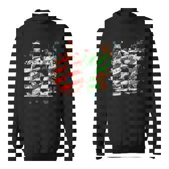 Melting Candy Cane 67 Christmas Santa Hat Holiday Sweatshirt | Mazezy