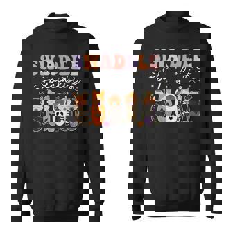 Swaddle Specialist Spooky Season Halloween NICU Nurse Sweatshirt Unisex | Mazezy