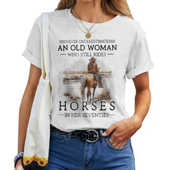Never Underestimate An Old Woman Who Still Rides Horses Women T-shirt - Thegiftio UK