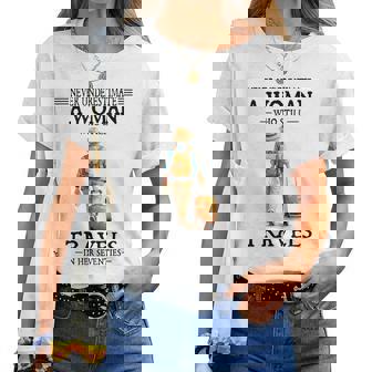 Never Underestimate A Woman Who Still Travels In Her Women T-shirt | Mazezy