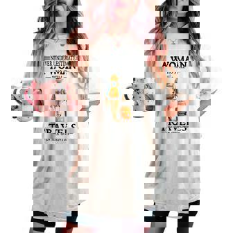 Never Underestimate A Woman Who Still Travels In Her Women's Oversized Comfort T-shirt | Mazezy