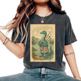 Nessie Playing Bagpipes Under A Rainbow In Scotland Women's Oversized Comfort T-Shirt - Thegiftio