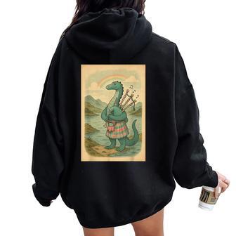 Nessie Playing Bagpipes Under A Rainbow In Scotland Women Oversized Hoodie Back Print - Thegiftio UK