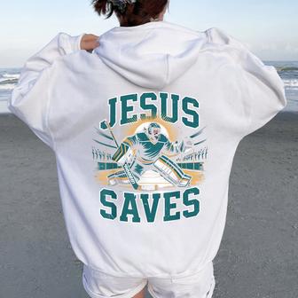 Christian Hockey Jesus Saves Goalie Humor Religious Hockey Women Oversized Hoodie Back Print - Thegiftio