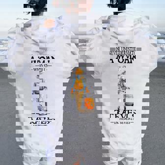 Never Underestimate A Woman Who Still Travels In Her Women Oversized Hoodie Back Print | Mazezy