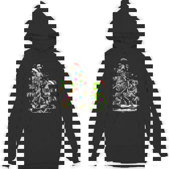 Alien And Bigfoot Wearing A Santa Hat And Christmas Lights Hoodie | Mazezy