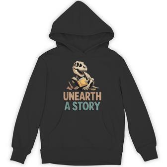 Unearth A Story T-Rex Reading A Book Summer Reading 2026 Hoodie - Monsterry