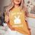 面白いイースタージョークguess What Bunny Butt メンズ レディース レディースオーバーサイズコンフォートTシャツ Mustard 面白いイースタージョークguess What Bunny Butt メンズ レディース レディースオーバーサイズコンフォートTシャツ Mustard