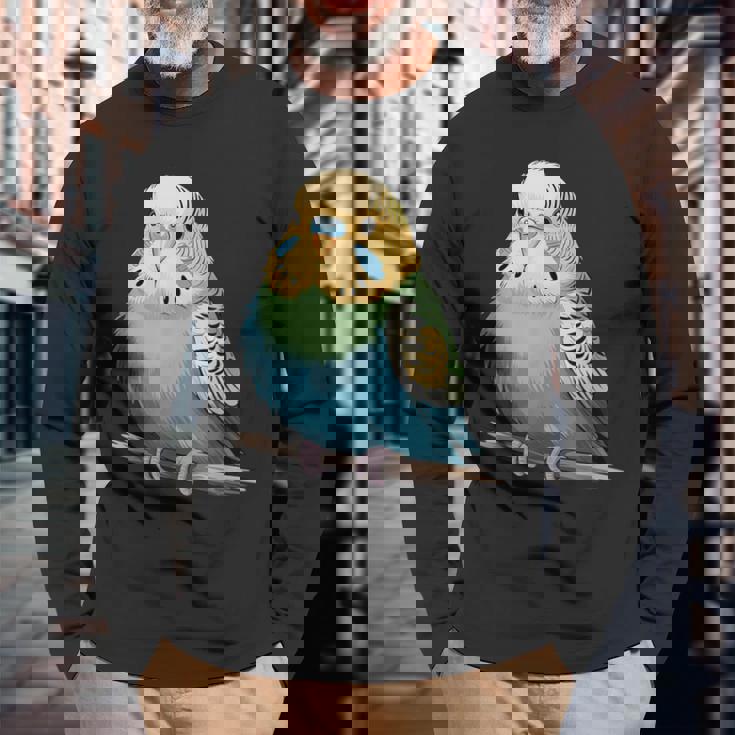 枝に腰掛けたチャーミングなセキセイインコ 長袖Tシャツ 高齢者への贈り物