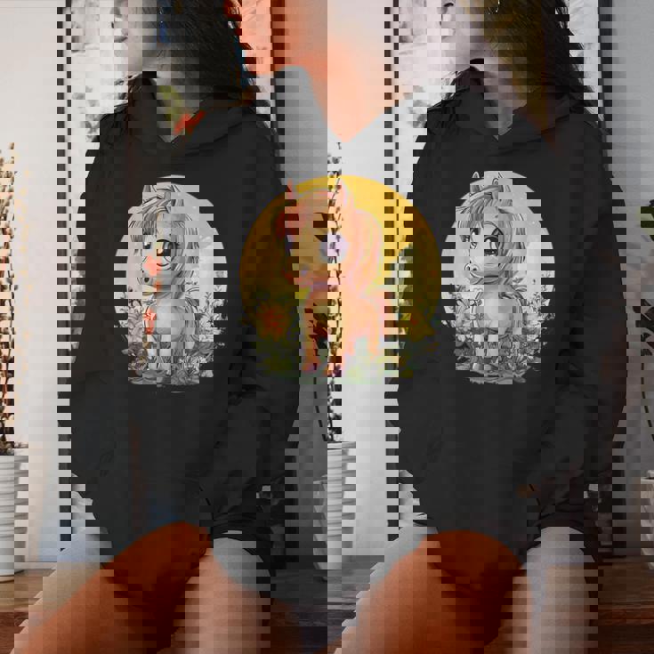 花畑に大きな目を持つかわいいポニー レディースパーカー 彼女への贈り物