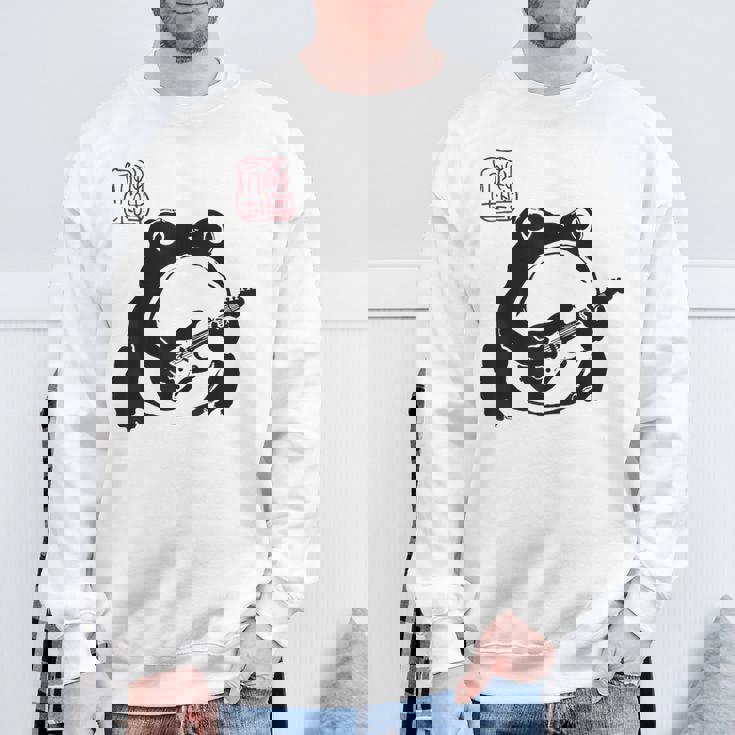 不機嫌そうなカエル 面白い ギター ロックミュージック アニメ 日本語 スウェットシャツ 高齢者への贈り物