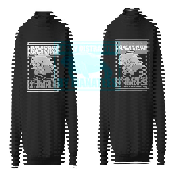 マナティーに気を取られる かわいいマナティー 面白い 海の動物 スウェットシャツ