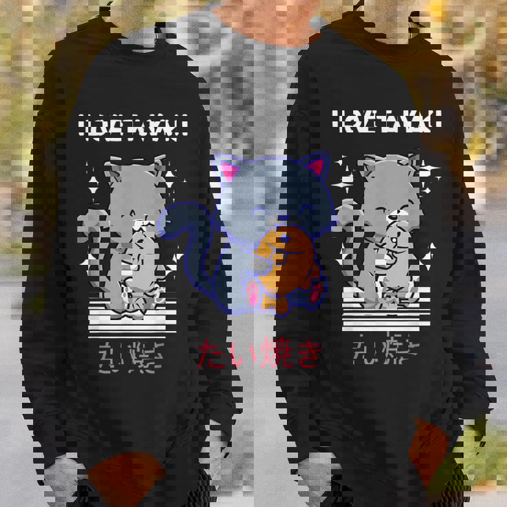 たい焼きが大好き かわいい かわいい 猫がたい焼きを食べる 日本アニメ スウェットシャツ 彼への贈り物