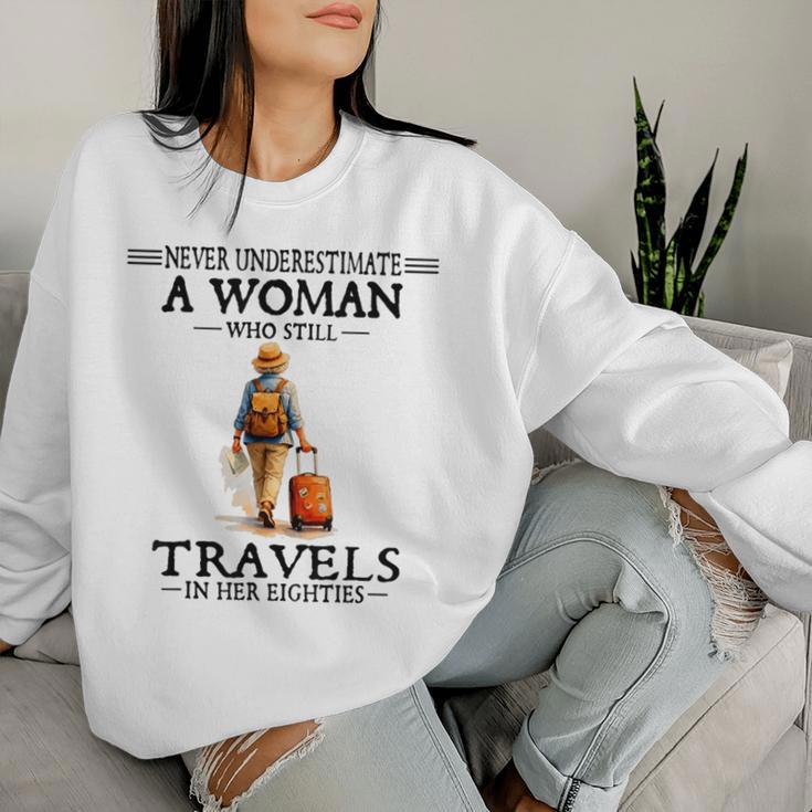 Never Underestimate A Woman Who Still Travels In Her 80'S Women Sweatshirt Gifts for Her