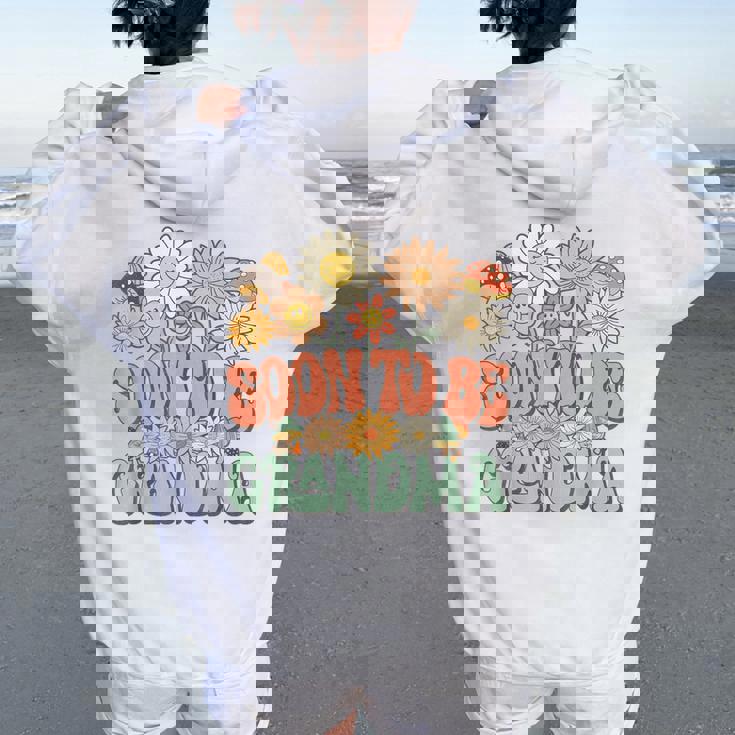 Soon To Be Grandma Expecting Baby Daisy Groovy Wildflower レディース オーバーサイズ パーカー バックプリント