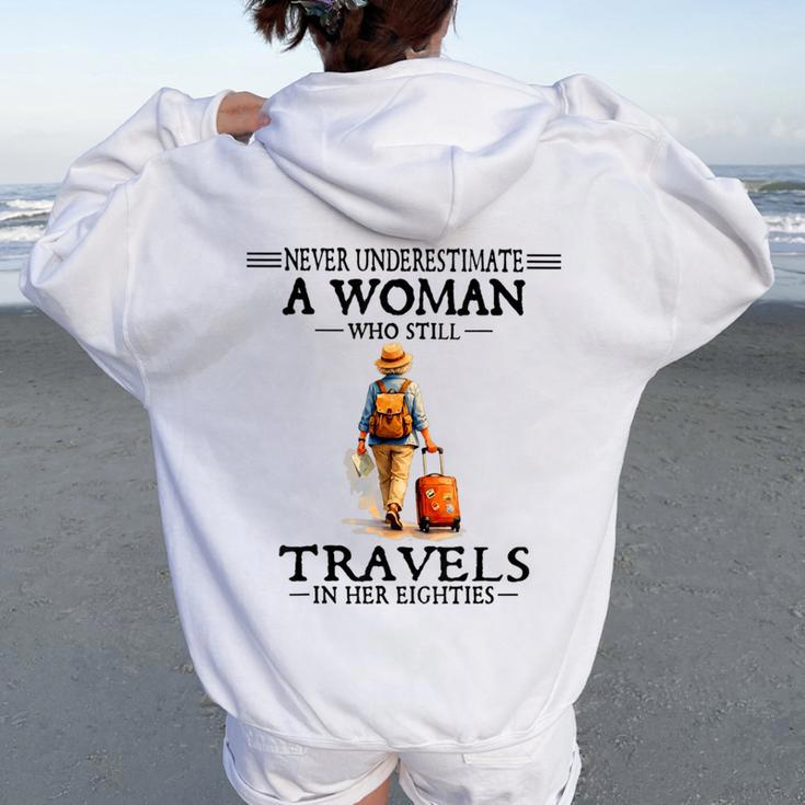 Never Underestimate A Woman Who Still Travels In Her 80'S Women Oversized Hoodie Back Print
