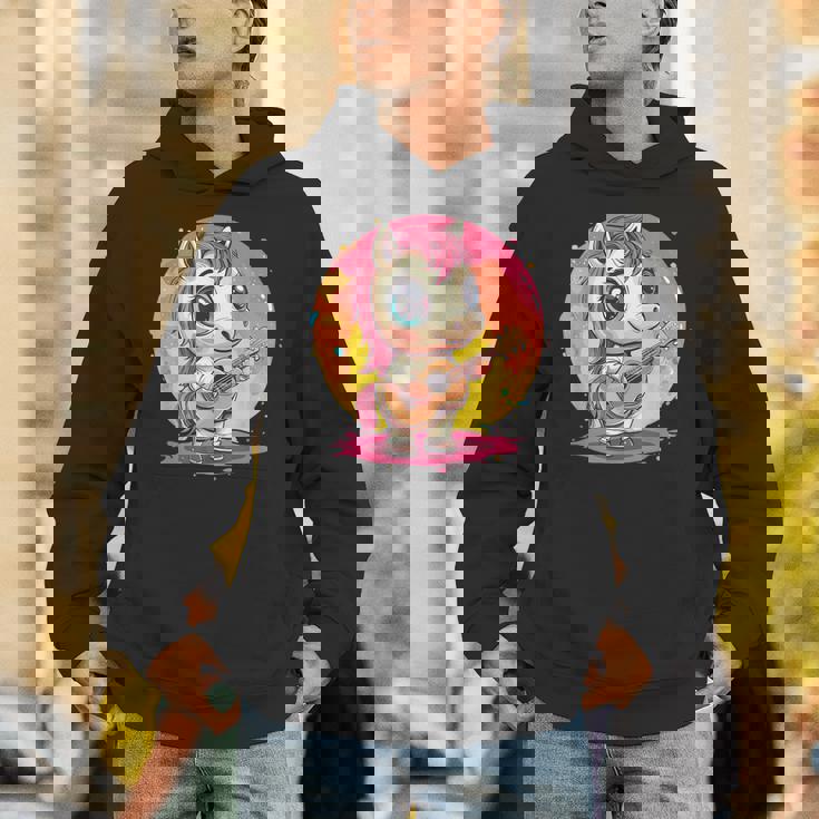 ギターを持った愛らしいポニー パーカー