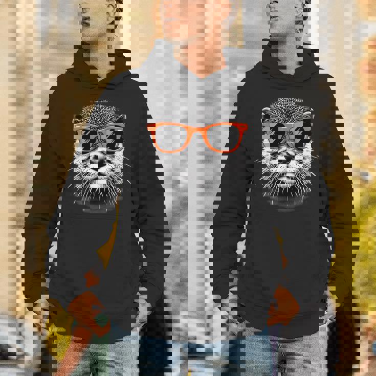 サングラスをかけたクールなカワウソのグラフィックアート 長袖tシャツ パーカー