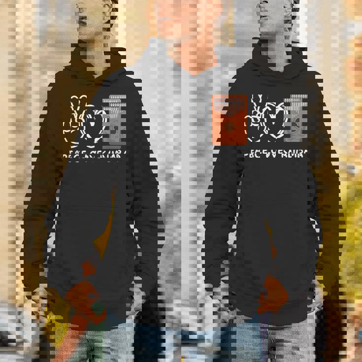 ピース、ラブカリンバレトロカリンバラバー パーカー