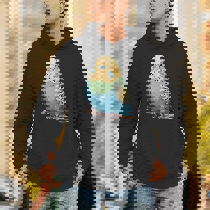 枝に腰掛けたチャーミングなセキセイインコ パーカー