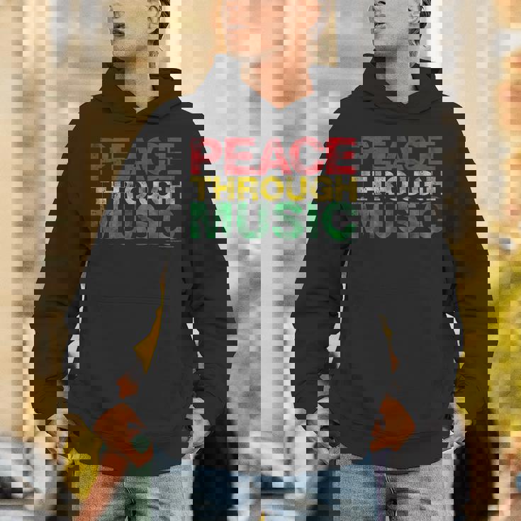 音楽を通して平和を変えるために遊ぶ パーカー