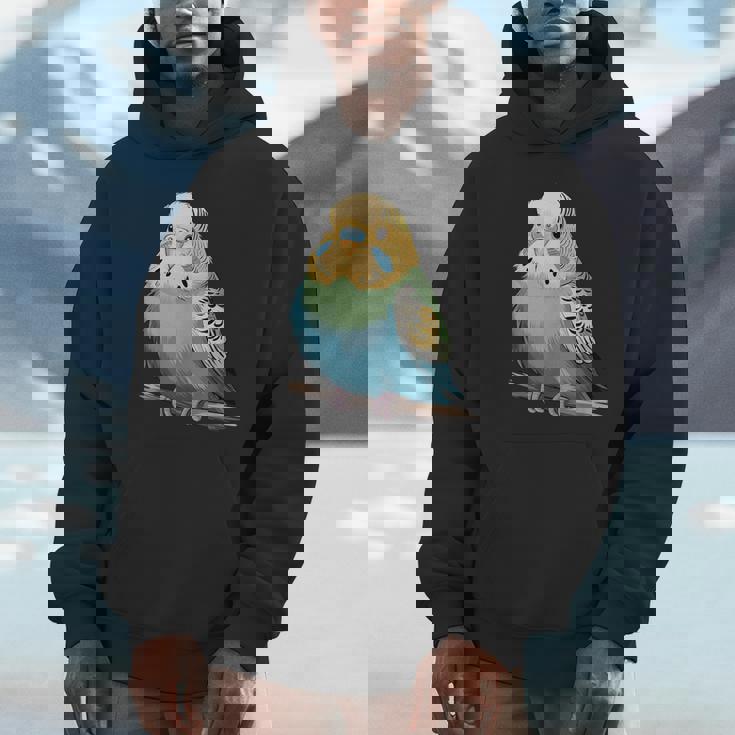 枝に腰掛けたチャーミングなセキセイインコ パーカー