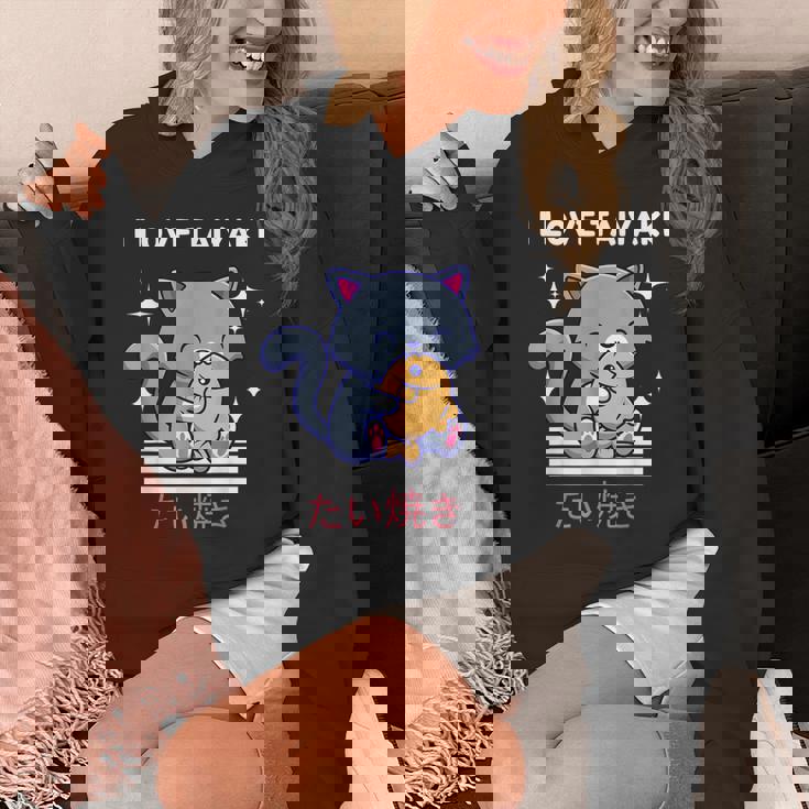 たい焼きが大好き かわいい かわいい 猫がたい焼きを食べる 日本アニメ パーカー