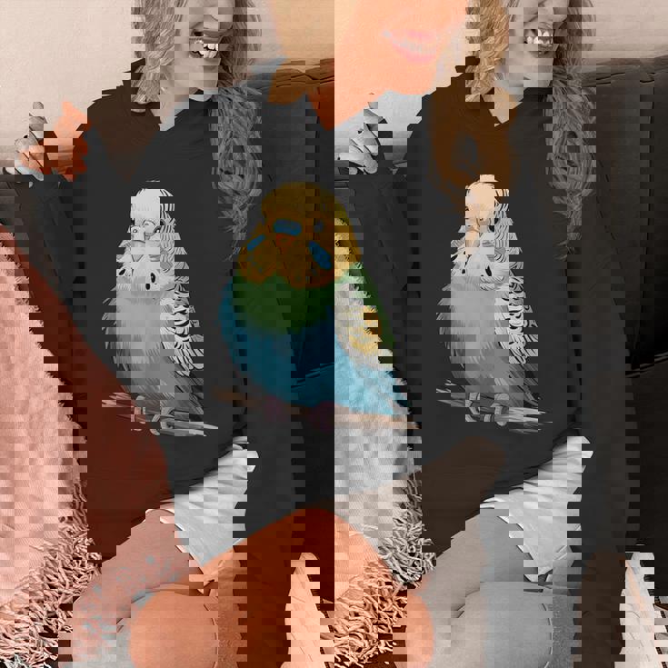 枝に腰掛けたチャーミングなセキセイインコ パーカー