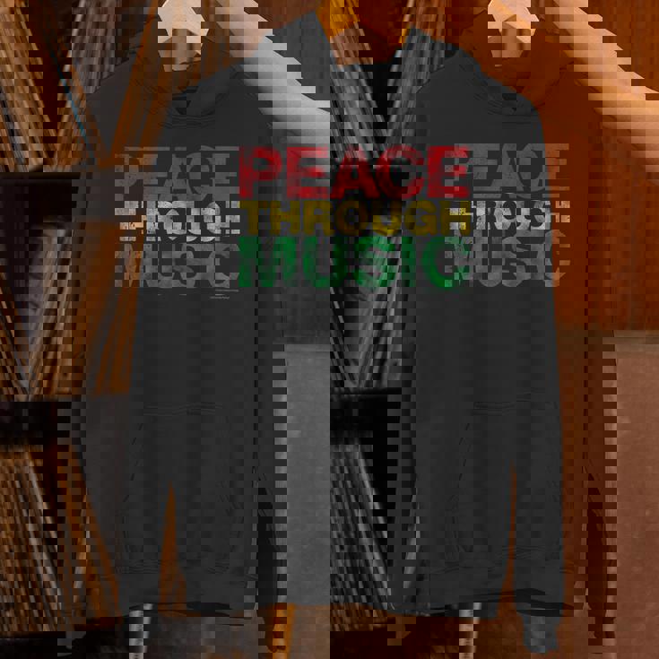 音楽を通して平和を変えるために遊ぶ パーカー