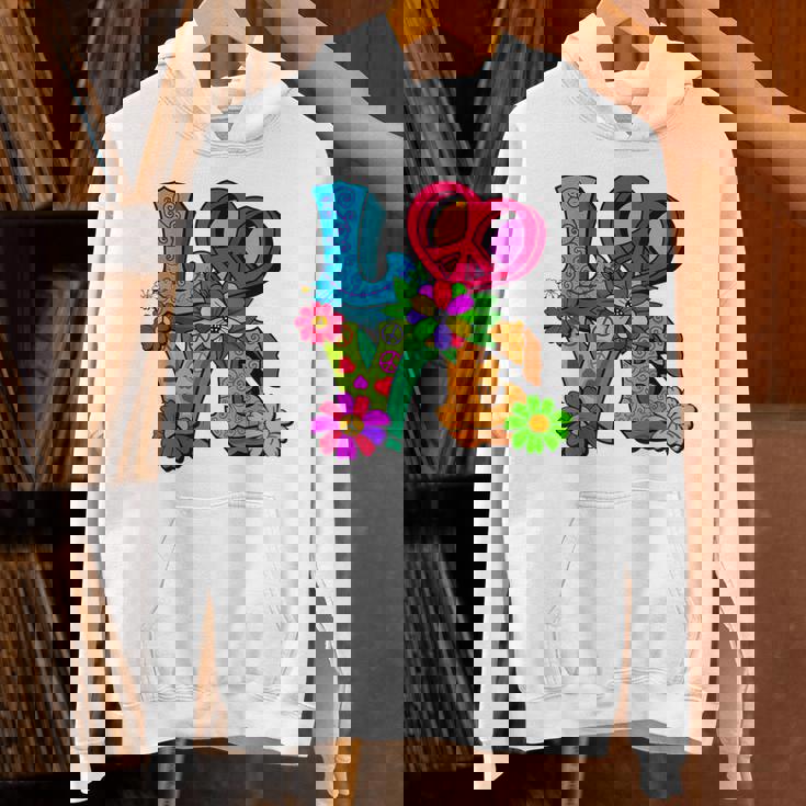 明るくカラフルな愛と平和 ピースサイン フラワートップ パーカー