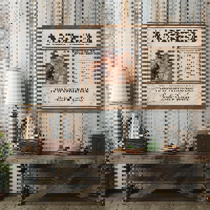 Wedding calendar canvas featuring ring icon marking the date, custom couple names, rustic wood texture, landscape wall decor