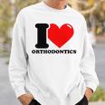 私は歯科矯正が大好きです スウェットシャツ 彼への贈り物