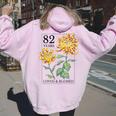82 Years Loved And Blessed 花柄 フラワースタンプ 82歳の誕生日 レディース オーバーサイズ パーカー バックプリント Light Pink