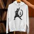 太極拳の練習をしている陽気な猫 陰陽 長袖tシャツ パーカー